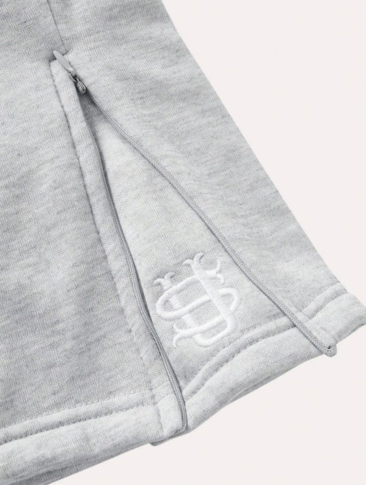 Pantalón chándal gris oversize con costuras y cordón elástico, logo bordado blanco
