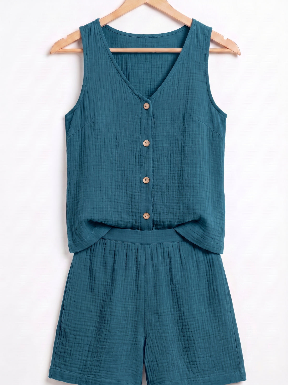 Conjunto de verano azul petróleo: top sin mangas con botones y short a juego