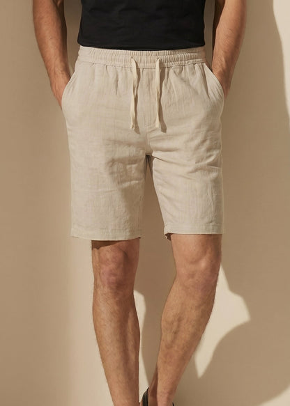 Bermuda de algodón beige con tiro elástico y cordón, bolsillos laterales