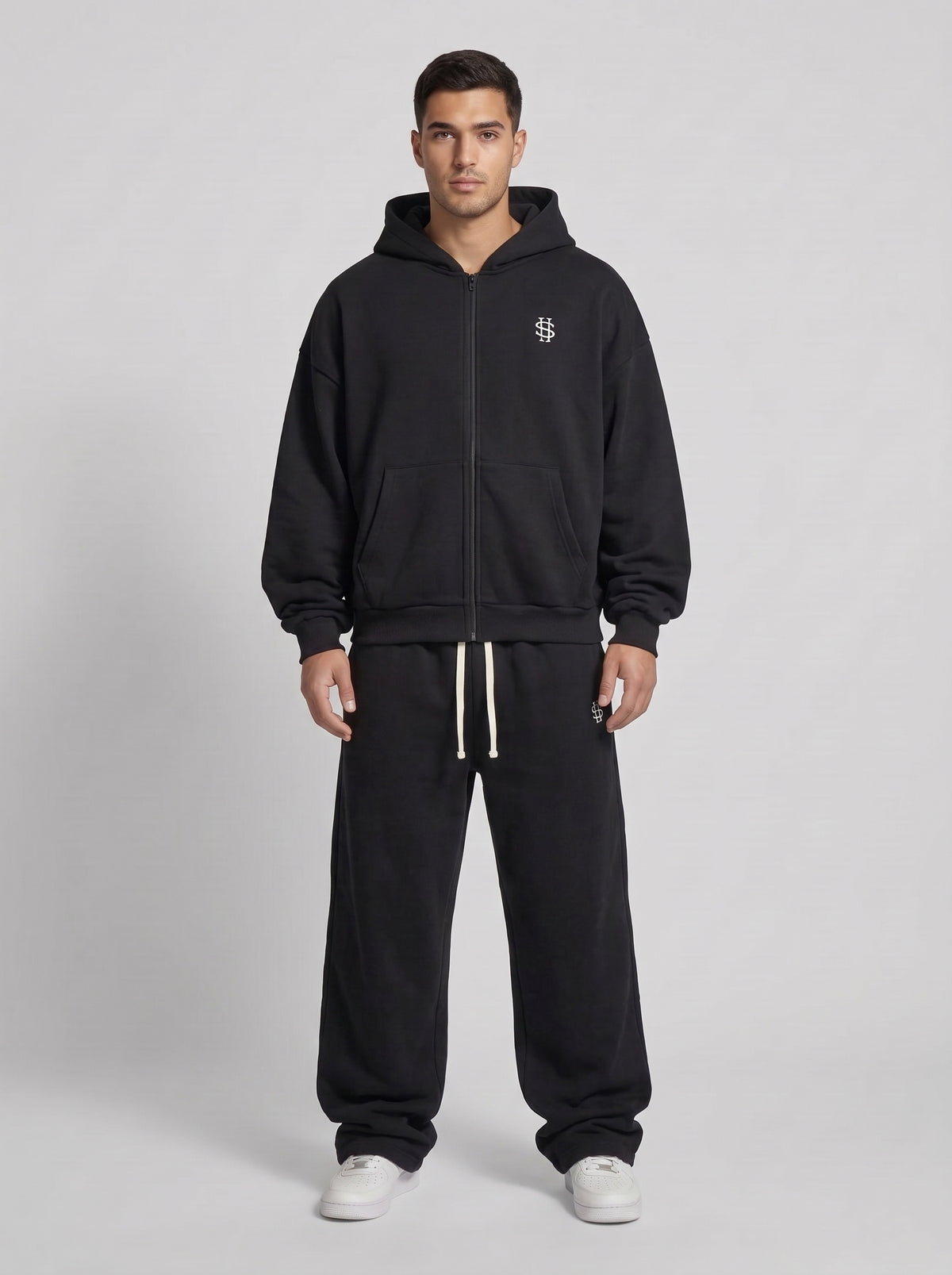 Chándal oversize negro: sudadera con capucha y cremallera, pantalón con cordón
