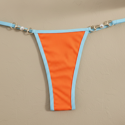 Braguita bikini bicolor naranja con ribete celeste y costuras al contorno