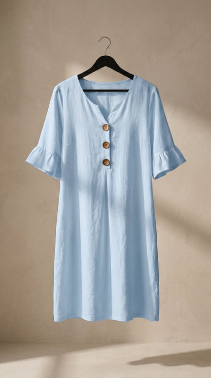 Vestido fluido azul claro con cuello en V y botones, mangas globo con volante